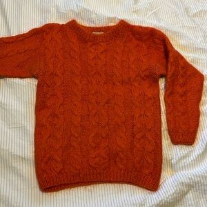 Bright orange knit sweater